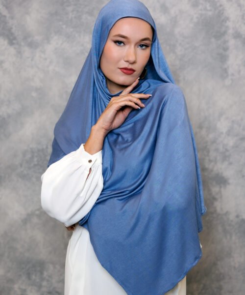 Dusty blue hijab styled elegantly with a soft drape.