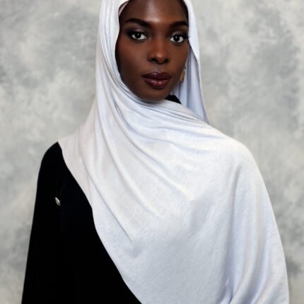 Elegant snow-white hijab styled gracefully with a smooth drape.