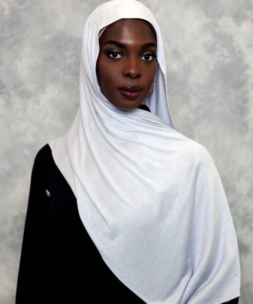 Elegant snow-white hijab styled gracefully with a smooth drape.