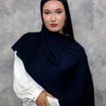 Deep navy blue hijab styled elegantly with a smooth drape.