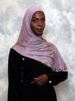 Shiny mauve satin hijab with soft lavender undertones, styled in an elegant drape.