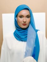 Luxury chiffon hijab in vibrant royal blue with elegant lightweight drape.