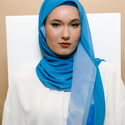 Luxury chiffon hijab in vibrant royal blue with elegant lightweight drape.