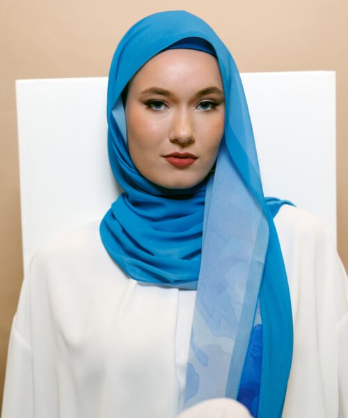 Luxury chiffon hijab in vibrant royal blue with elegant lightweight drape.